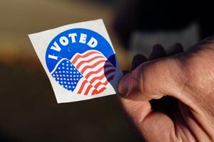 A voter holds an “I Voted” sticker Nov. 8, 2022, at Memorial Hall in Jim Thorpe Carbon County, Pennsylvania.