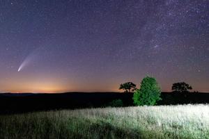 An orange glow in the sky indicates light pollution.