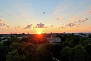 Sunset over Old Main on Penn State's campus in State College, Pennsylvania.