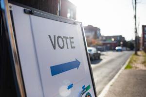 A “vote” sign outside of a polling place.