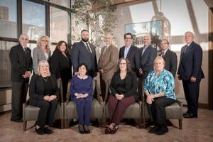 Some trustees of the Pennsylvania public school pension system, PSERS, pose with executive director Glen Grell (right) at the $60 billion-asset agency's Harrisburg office tower in 2020. Chairman Chris Santa Maria, a Harriton High School social studies teacher, is at center.