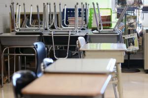 Empty desks and chairs are pictured in a classroom at Loring Flemming Elementary School in Blackwood, N.J., on Wednesday, Oct. 14, 2020. The school is on a hybrid in-person and virtual learning model due to the coronavirus pandemic.