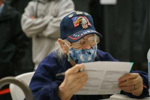 A voter studies a provisional ballot while filling it out in South Philadelphia on Election Night 2020. As of Thursday morning, roughly 27,500 had been processed and reported to the state, unofficial results show.