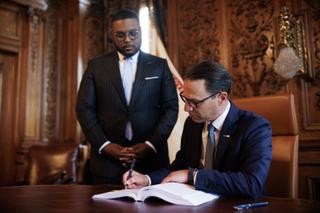 Democratic Gov. Josh Shapiro, joined by Lt. Gov. Austin Davis, signs the main budget bill in August.