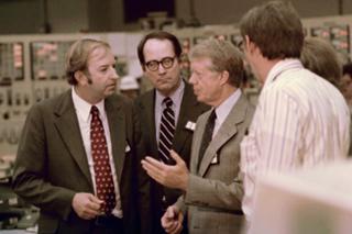 FILE - In this April 1, 1979, file photo President Jimmy Carter talks in the control room of Three Mile Island nuclear plant in Middletown, Pa., with from left, Harold Denton, Director of the U.S. Nuclear Agency, Pennsylvania Gov. Dick Thornburgh, and an unidentified control room employee.   Thornburgh died Thursday, Dec. 31, 2020 at a retirement community facility outside Pittsburgh, his son David said.  (AP Photo, File)