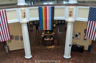 A Pride flag is currently hanging inside the Capitol’s East Wing Rotunda as part of a permitted display requested by the Commission on LGBTQ Affairs’ executive director. A Pride flag is currently hanging inside the Capitol’s East Wing Rotunda as part of a permitted display requested by the Commission on LGBTQ Affairs’ executive director.