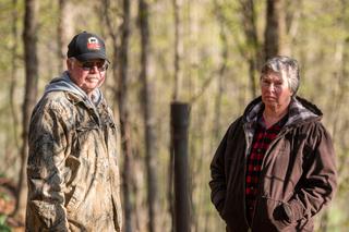 Cheryl and Joe Thomas with one of dozens of abandoned wells on their Duke Center, Pennsylvania, property.