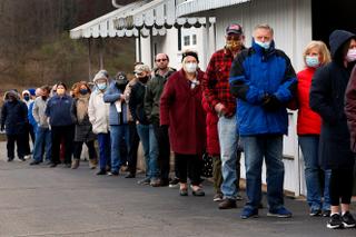Voters stand in a line that kept growing in Jackson Township with a wait time of over an hour or more to voteat the Jackson Township Volunteer Fire House    FRED ADAMS/For the Inquirer 11-3-2020