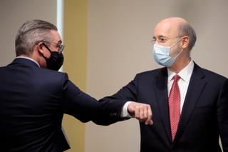 In January 2021, Al Schmidt bumped elbows with Democratic Gov. Tom Wolf after speaking out against efforts to overturn Pennsylvania's presidential election results.