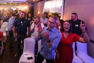Supporters of Pennsylvania GOP governor candidate Doug Mastriano sing songs of worship before seeing him May 17 at his campaign party in Chambersburg. 