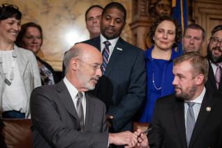 Gov. Tom Wolf and state Rep. Bryan Cutler (R., Lancaster) shook hands after the signing of Act 77. 