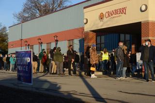 Voters line up outside the Cranberry Municipal Center in Cranberry Township, Butler County, in the first hour of voting on Election Day 2020.