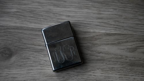 A lighter engraved with Adam Kalinowski’s initials as photographed Wednesday, March 3, 2021.