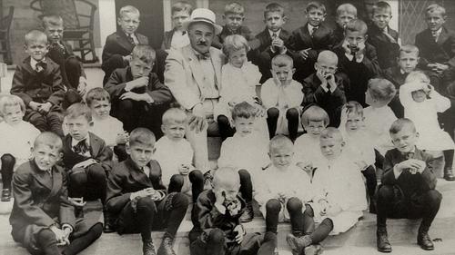 Milton Hershey pictured with students in 1913