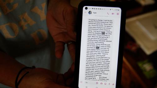 Susan Ousterman, mother of Tyler Cordeiro, holds a saved text message she received from her son