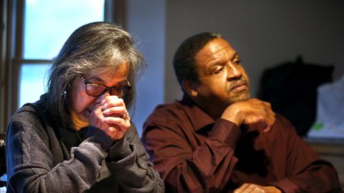 Fe Hall reacts sitting next to her husband Gareth as they are interviewed in their Stroudsburg home in Monroe County