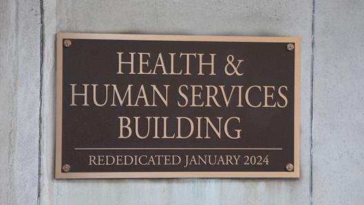 A placard outside the Pennsylvania Health & Human Services building in Harrisburg.