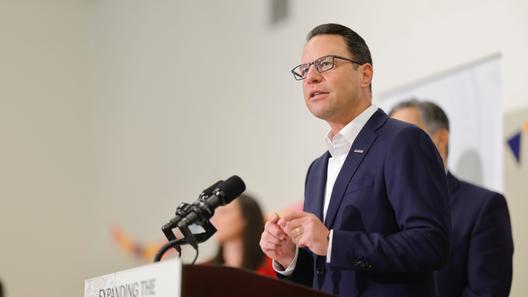 Gov. Josh Shapiro speaks at a news conference, highlighting child care recruitment and retention bonuses that were passed as part of the 2025-26 state budget.