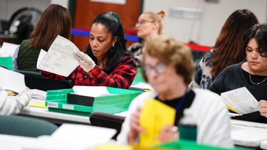Workers sort mail ballots at the Lehigh County Government Center in Allentown on Nov. 8, 2022.