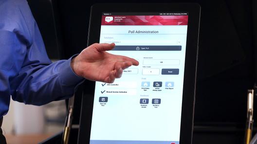A former Luzerne County election administrator shows a class how to set up new voting machines in 2021.