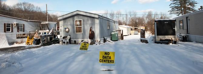 A “no data centers” sign sits in front of a home in Valley View Estates, which is set to be surrounded by data centers.