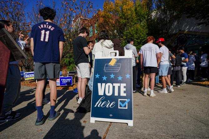 People wait in line to vote Nov. 5, 2024, at the Banana Factory in Bethlehem, Pennsylvania. People wait in line to vote Nov. 5, 2024, at the Banana Factory in Bethlehem, Pennsylvania.