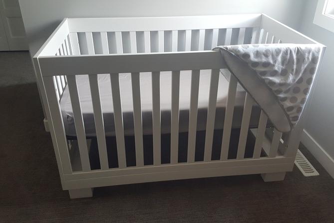 A crib in a room.