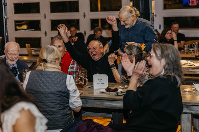 The winning trivia team celebrates at the third annual “Clink and Think” Quiz Bash Fundraiser on Oct. 26, 2025, at Axemann Brewery in Bellefonte.