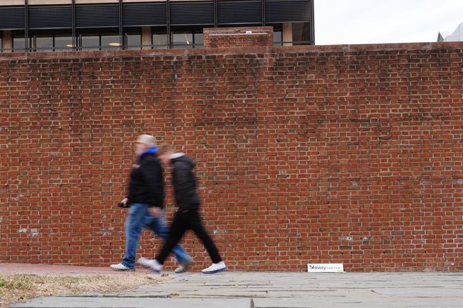 People walk past locations of the now removed explanatory panels that were part of an exhibit on slavery at President's House Site in Philadelphia. People walk past locations of the now removed explanatory panels that were part of an exhibit on slavery at President's House Site in Philadelphia.
