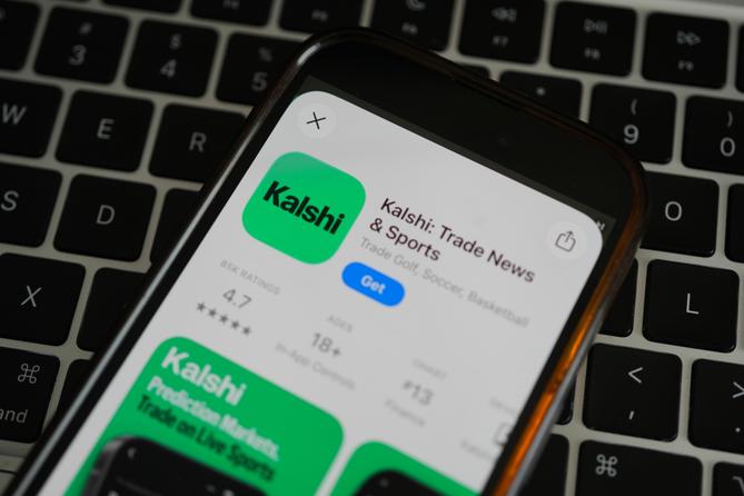 An ad for the prediction market app Kalshi is displayed on a mobile phone Thursday, April 16, 2026. An ad for the prediction market app Kalshi is displayed on a mobile phone Thursday, April 16, 2026.