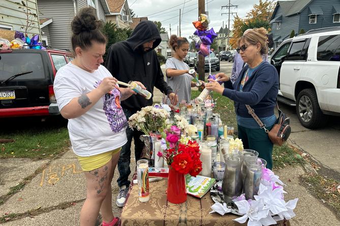 People gather at a memorial in Erie, Pa., Sunday, Oct. 11, 2026, outside the home where authorities say a gunman killed several people before killing himself on Oct. 9. People gather at a memorial in Erie, Pa., Sunday, Oct. 11, 2026, outside the home where authorities say a gunman killed several people before killing himself on Oct. 9.