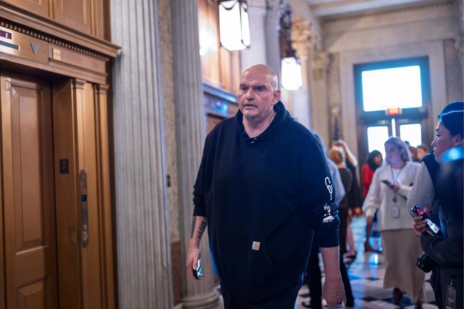 Sen. John Fetterman, D-Pa., arrives as senators prepare for a vote on an Iran war resolution sponsored by Sen. Tim Kaine, D-Va., at the Capitol in Washington, Wednesday, March 4, 2026. Sen. John Fetterman, D-Pa., arrives as senators prepare for a vote on an Iran war resolution sponsored by Sen. Tim Kaine, D-Va., at the Capitol in Washington, Wednesday, March 4, 2026.