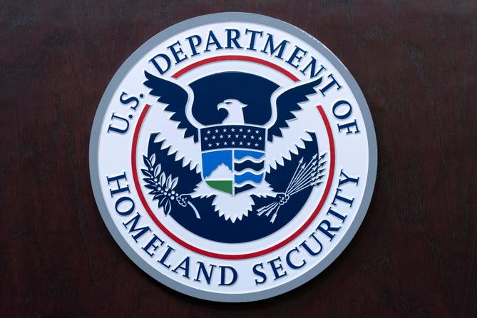 The seal of U.S. Department of Homeland Security is seen before a news conference at ICE Headquarters in Washington, May 21, 2025. The seal of U.S. Department of Homeland Security is seen before a news conference at ICE Headquarters in Washington, May 21, 2025.