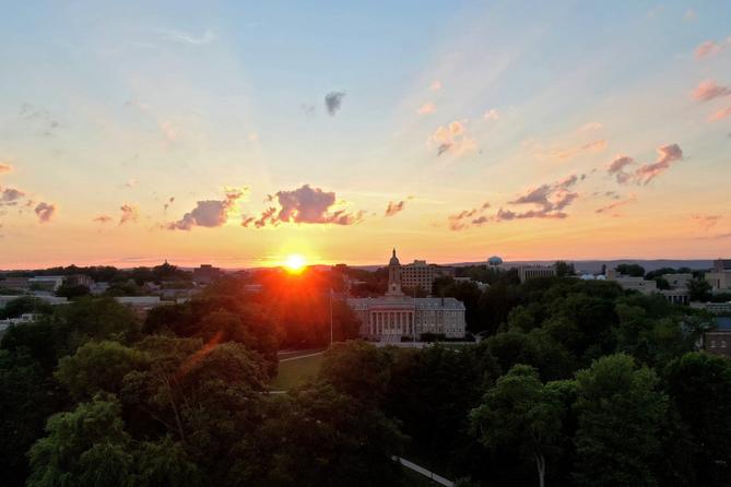 The sun over Old Main on Penn State’s University Park campus