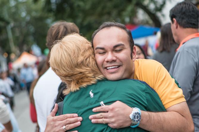 Phoenixville Mayor Peter Urscheler hugs someone at an event.