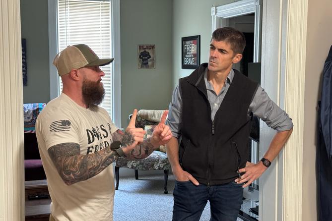 Ryan Crosswell (right), a Democratic candidate for Pennsylvania’s 7th congressional district, listens to former Marine Chris Yarnell (left).