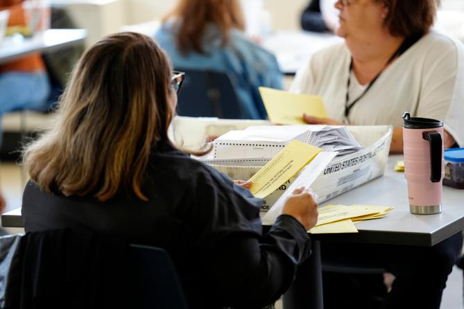 Workers sort mail ballots on Nov. 7, 2023, at Northampton County Courthouse in Easton, Pennsylvania.