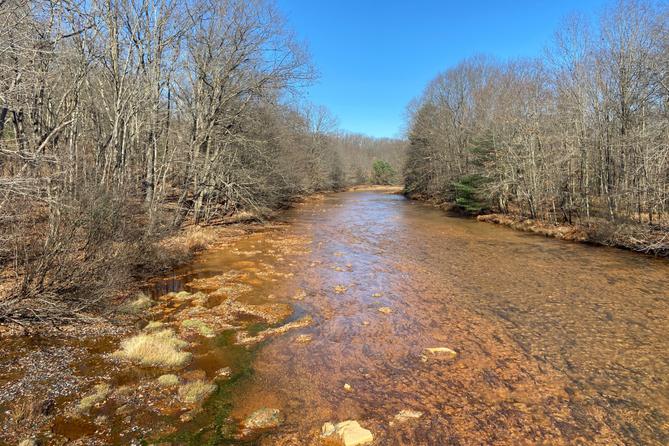 A stream along Coaldale Road in Rush Township, Centre County, runs orange from acid mine drainage.