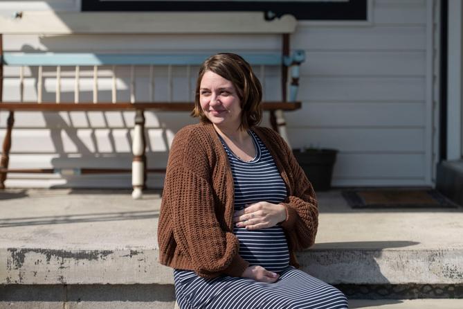 Jessie Larabee, who is pregnant, poses for a photograph outside her St. Marys home.