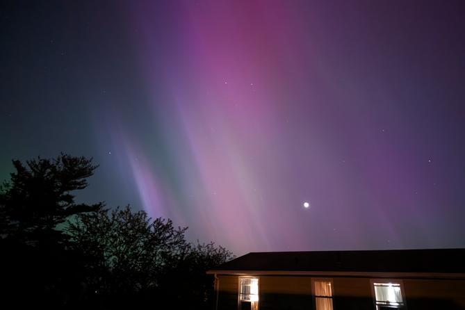 The northern lights and moon in Somerset County.