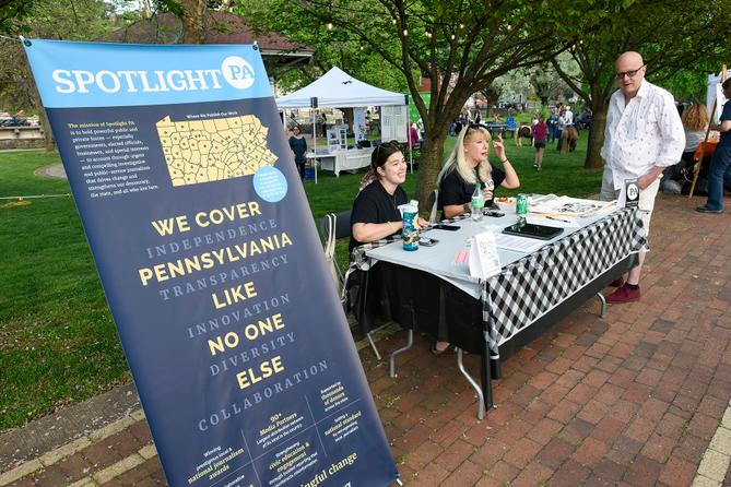 Sarah Rafacz and Michelle Mertz at the Spotlight PA State College booth at Centre Gives Fest in 2023.