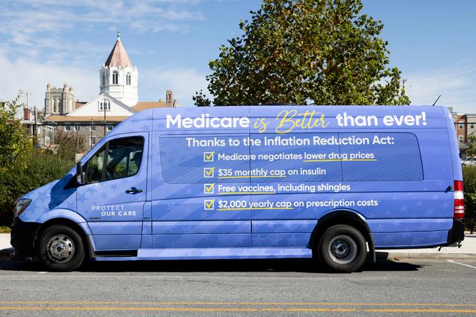 A van advertising changes to Medicare created by the Inflation Reduction Act sits outside the Heinz-Menaker Senior Center in Harrisburg.