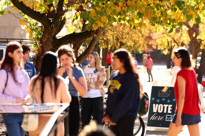 College students from the University of Pittsburgh and Carnegie Mellon University enter the polling station at Bellefield Hall on Nov. 5, 2024.