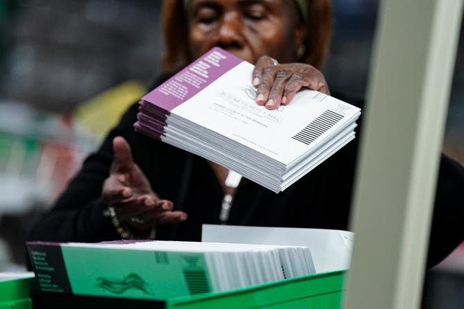 Lehigh County voter registration workers sort mail ballots Nov. 5, 2024, at Lehigh County Government Center in Allentown, Pa.
