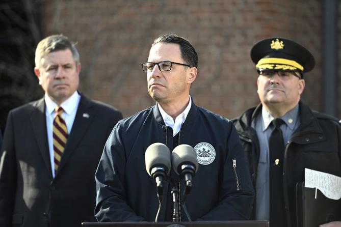 Gov. Josh Shapiro (center) is flanked by Dauphin County DA Fran Chardo (left) and Colonel Christopher Paris of the State Police