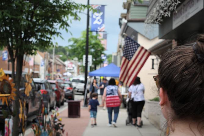 People walking the business district in Zelienople, Butler County, PA.