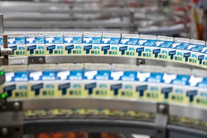 Milk cartons on a production line.