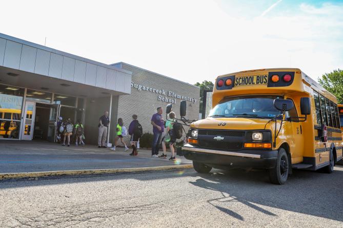 Sugarcreek Elementary School students arrive at school on Friday morning, May 24, 2024.