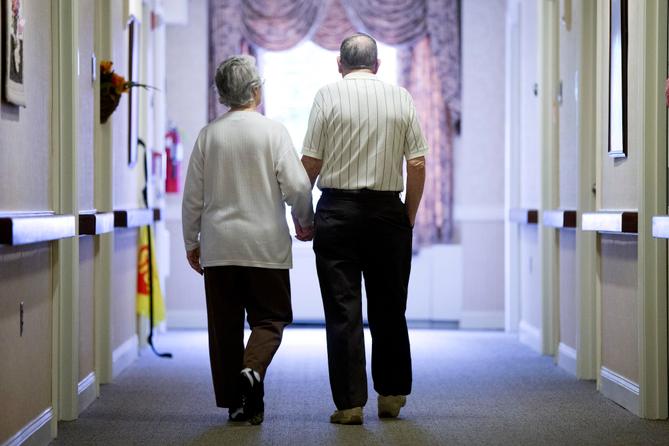 An older couple in the hall of a nursing home in Easton, PA.