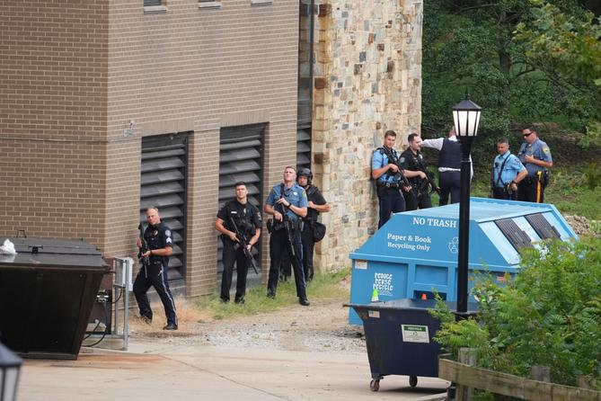 Police gather at the Villanova University campus where an active shooter was reported Thursday, Aug. 21, 2025, in Villanova, Pennsylvania